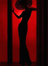 Схема вышивки «силуэт дамы в шляпе на красном фоне»