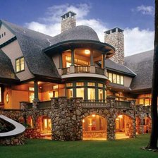 foto-de-casa-de-lujo-luces-encendidas-con-partes-de-piedra